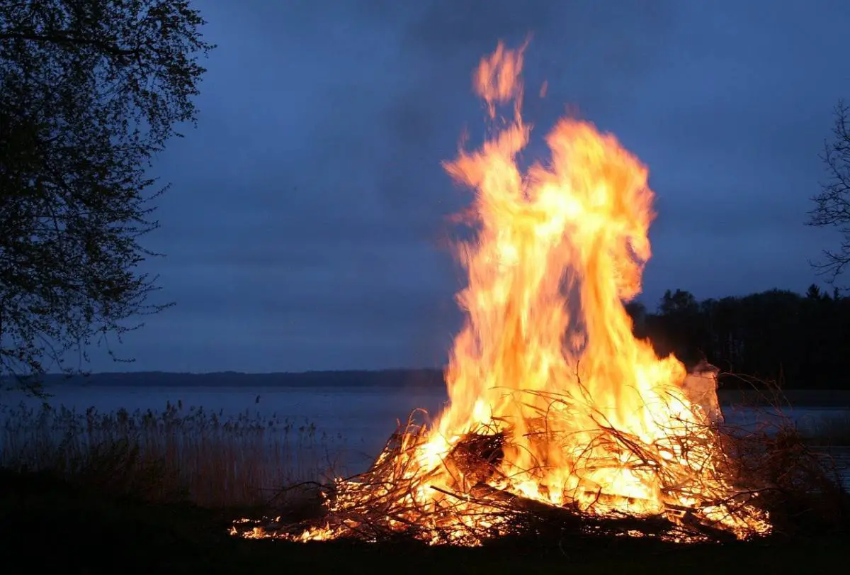 bonfire by lake at night