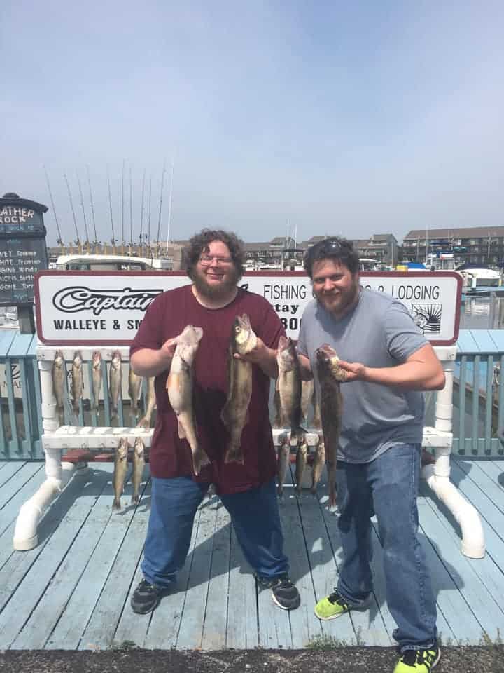 Two anglers holding Lake Erie Walleye